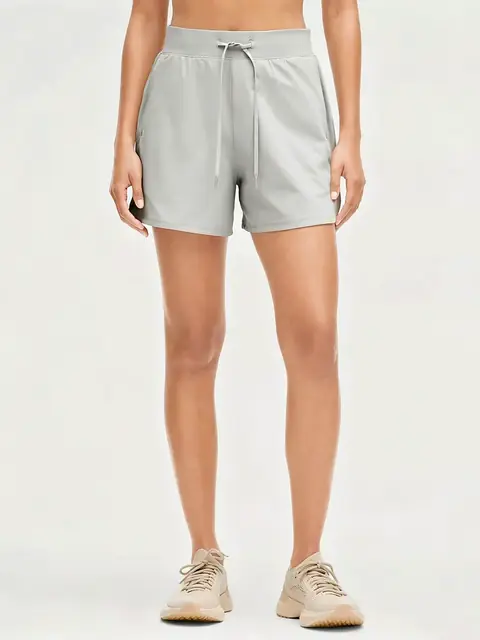 Drawstring zip yoga shorts in cream apricot front view