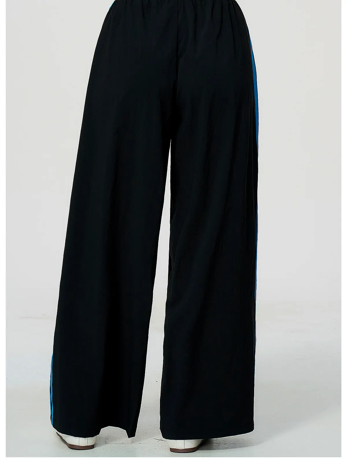 Contrast-Stripe Wide-Leg Track Pants — fabric close-up