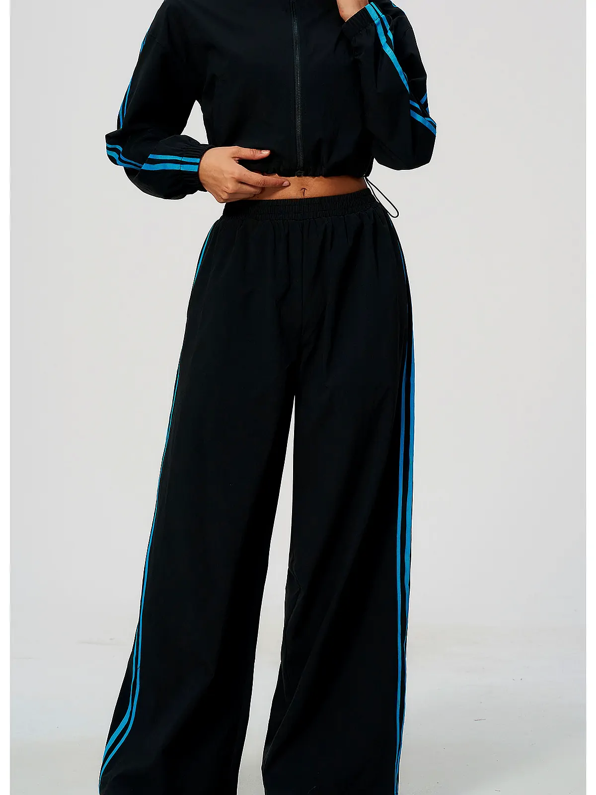 Contrast-Stripe Wide-Leg Track Pants — flatlock seam detail